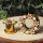 Goldener Flesh Tunnel mit Blumen und Perlen